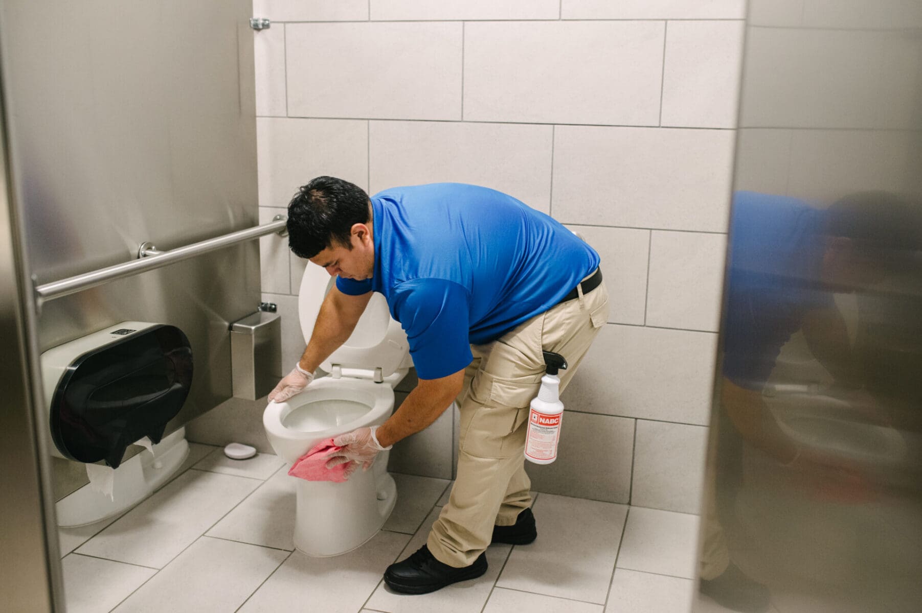 day porter cleaning a bathroom