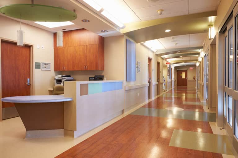 Empty Nurses Station And Corridor In Modern Hospital Empty Nurses Station And Corridor In Modern Hospital