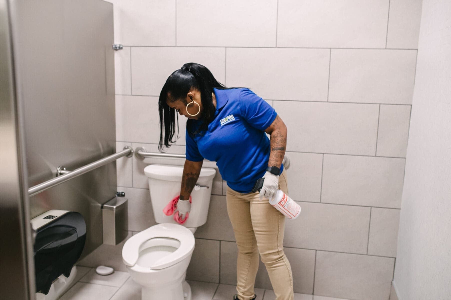 woman cleaning restroom