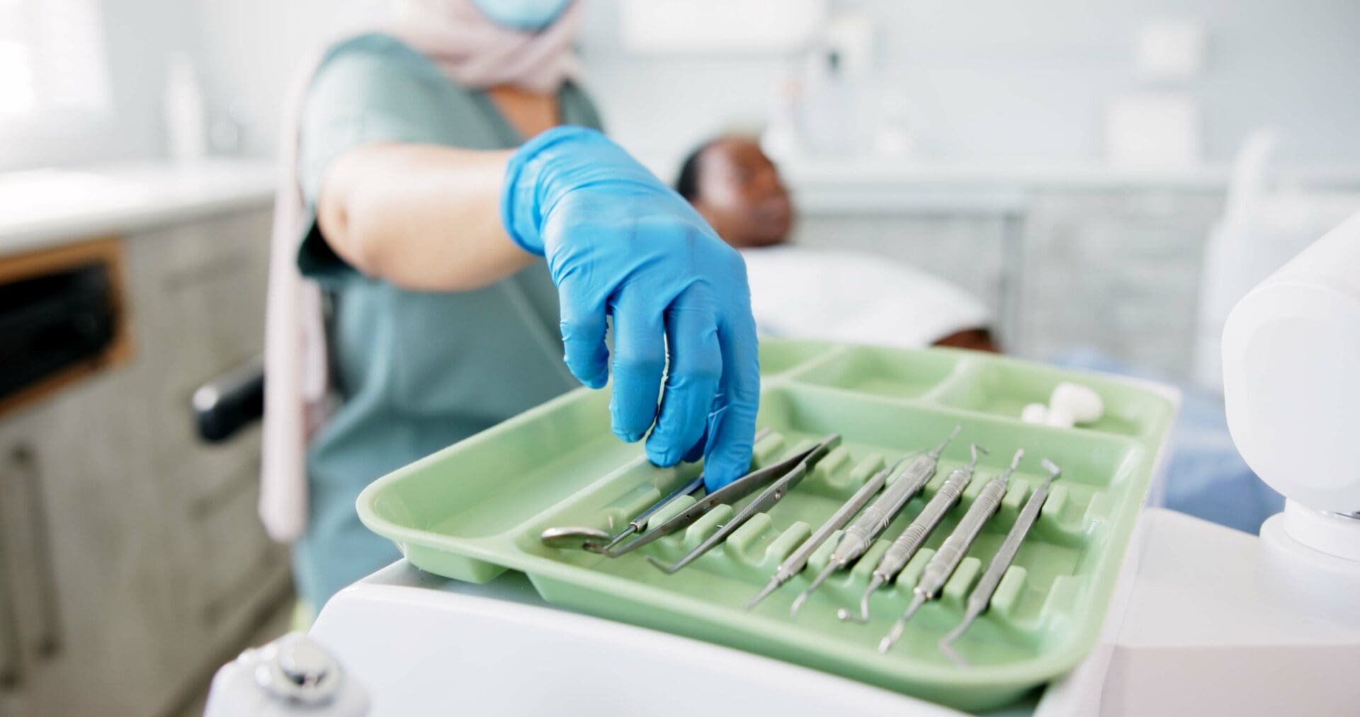 dentist grabbing tools