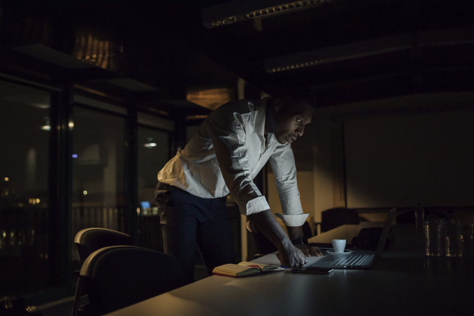 a man working in an office at night