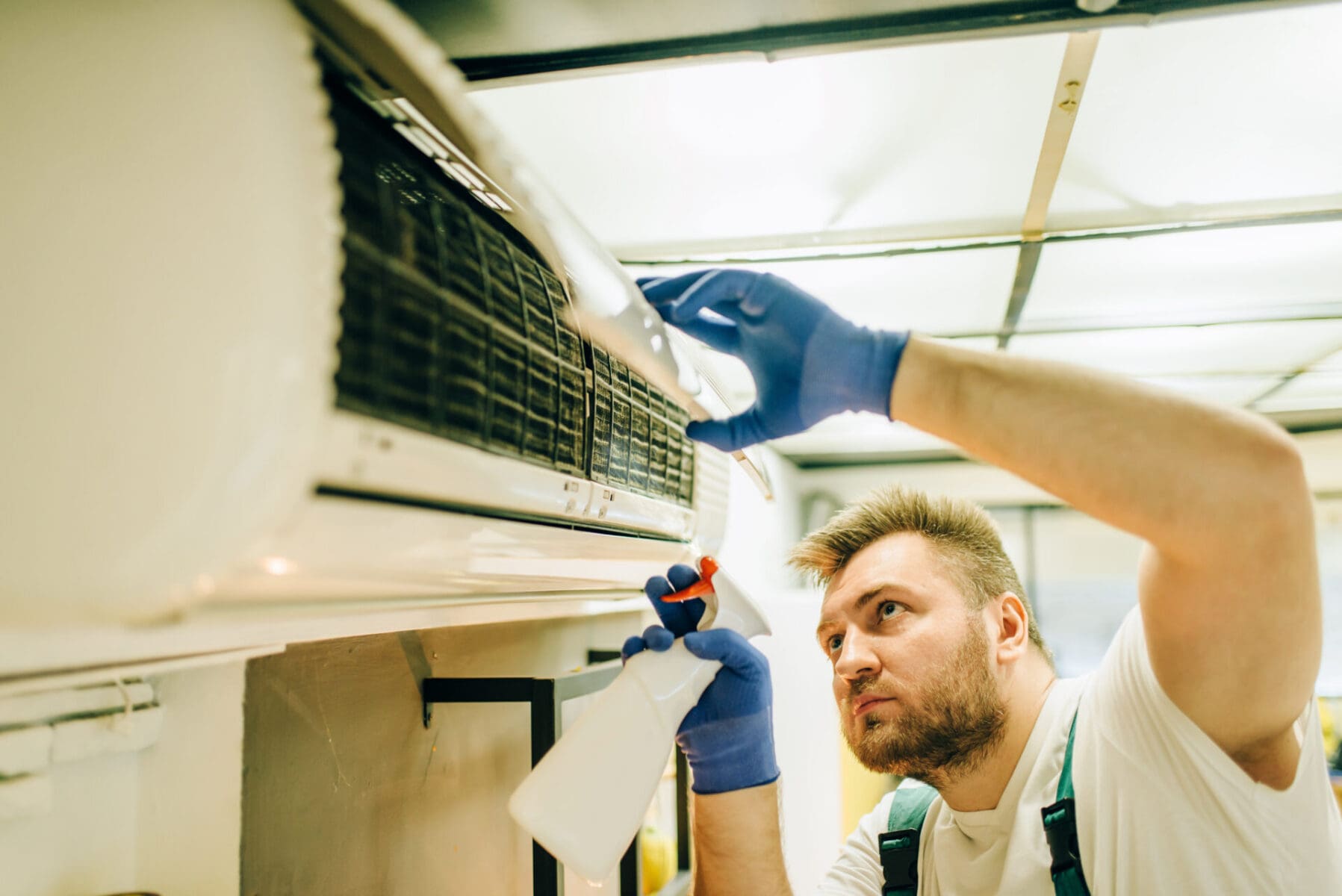 person cleaning HVAC System