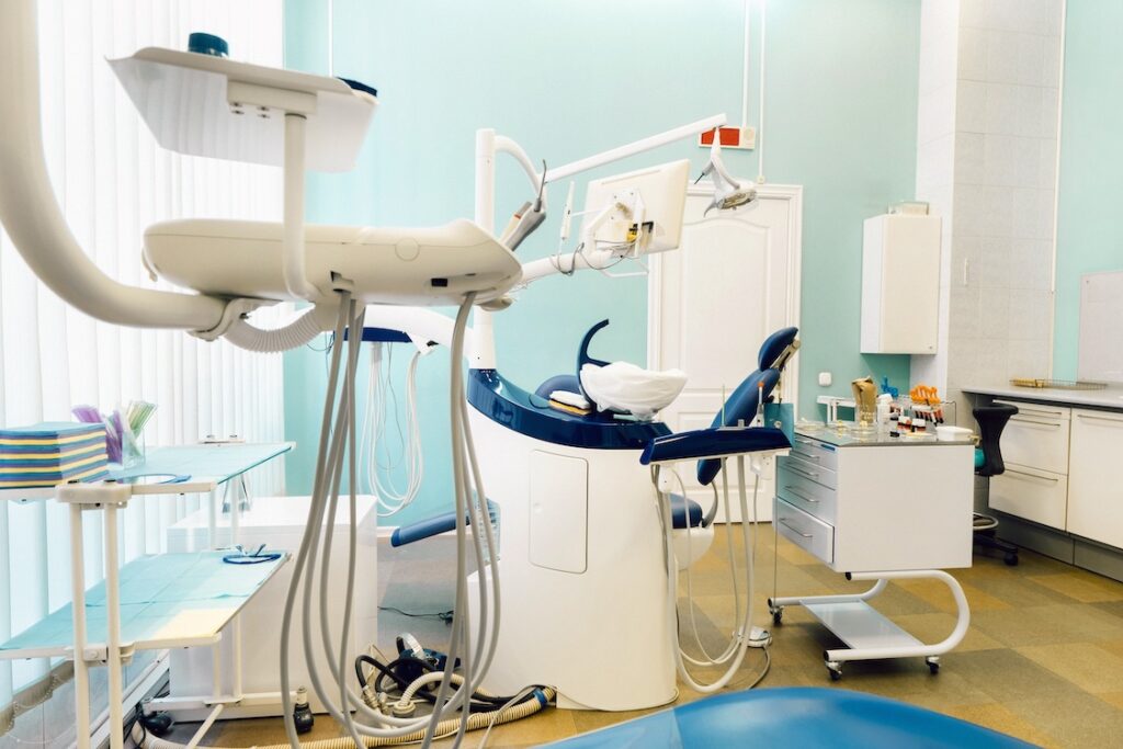An empty chair in the dentist's office.