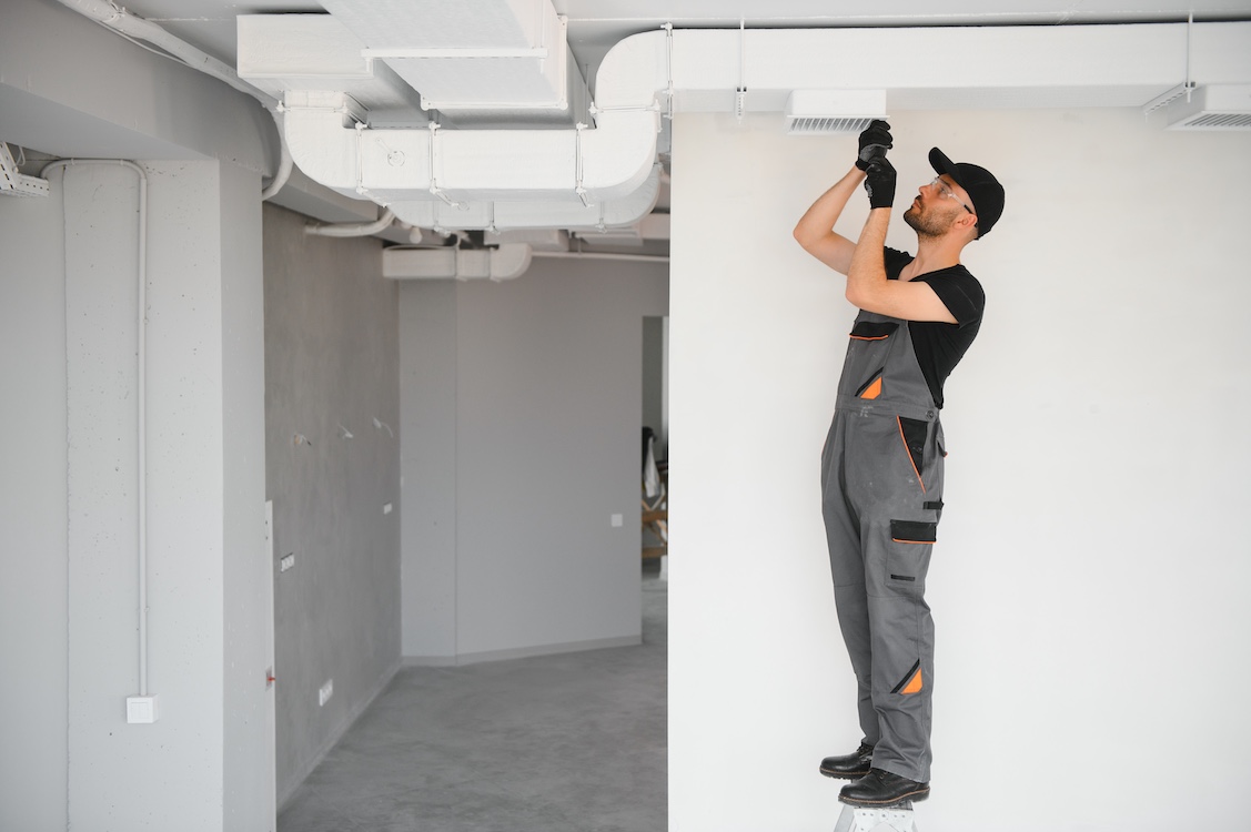 Ventilation cleaning services Ventilation cleaning. Specialist at work. Repair ventilation system HVAC.