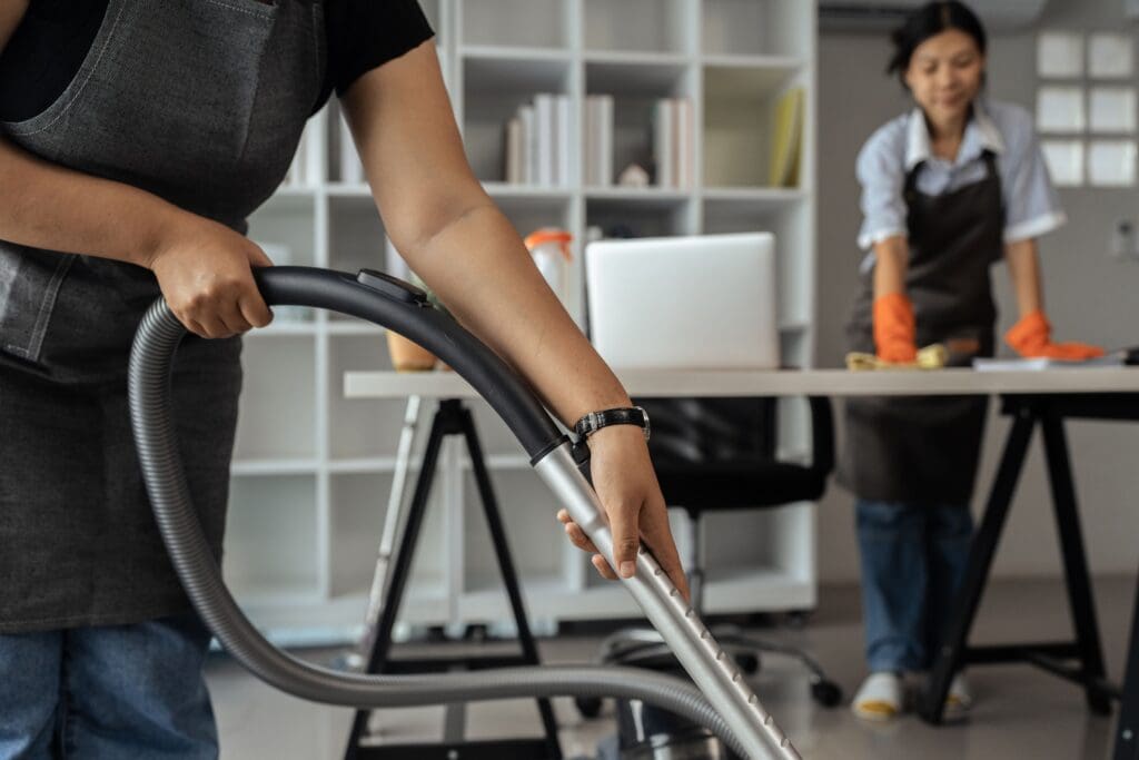 janitorial services lady vacuuming