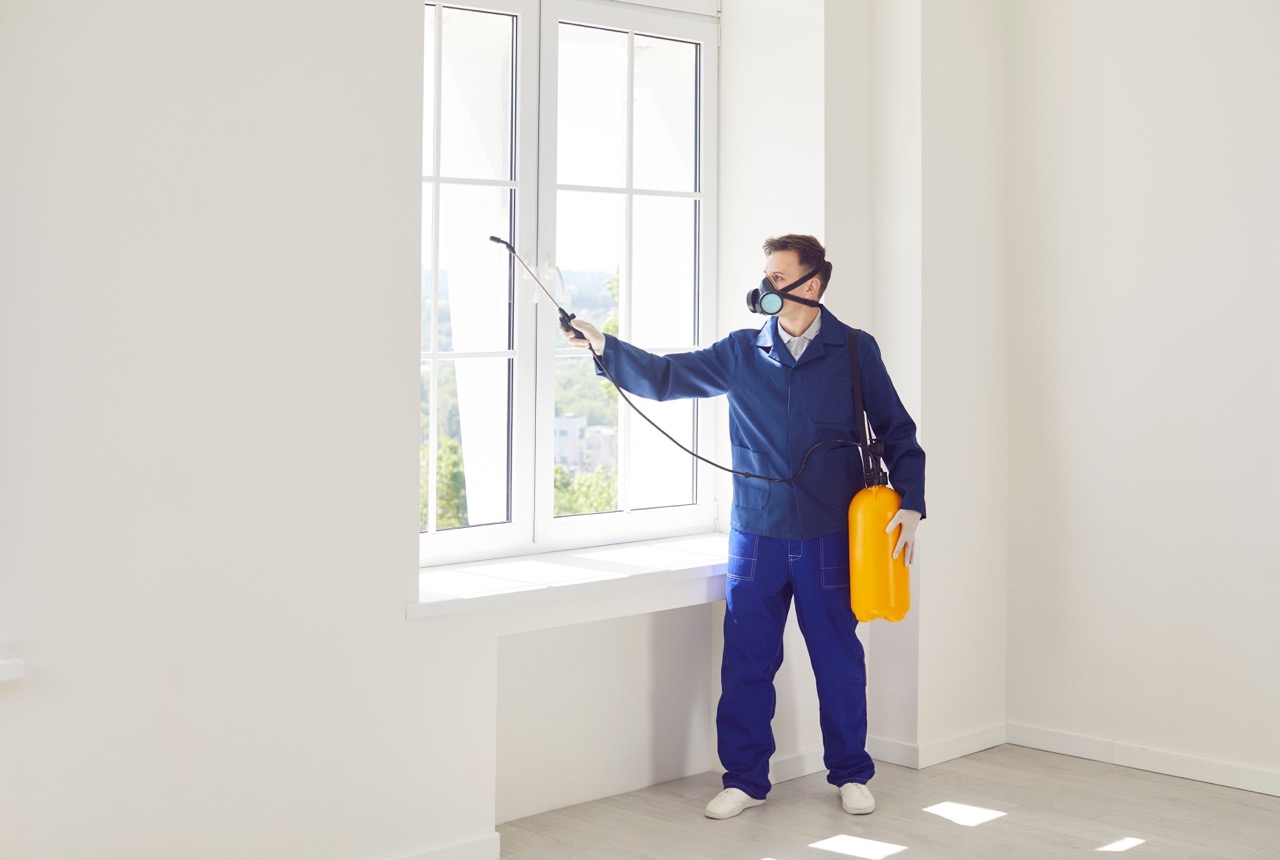 Man,Worker,From,The,Pest,Control,Service,Using,Equipment,,Diligently