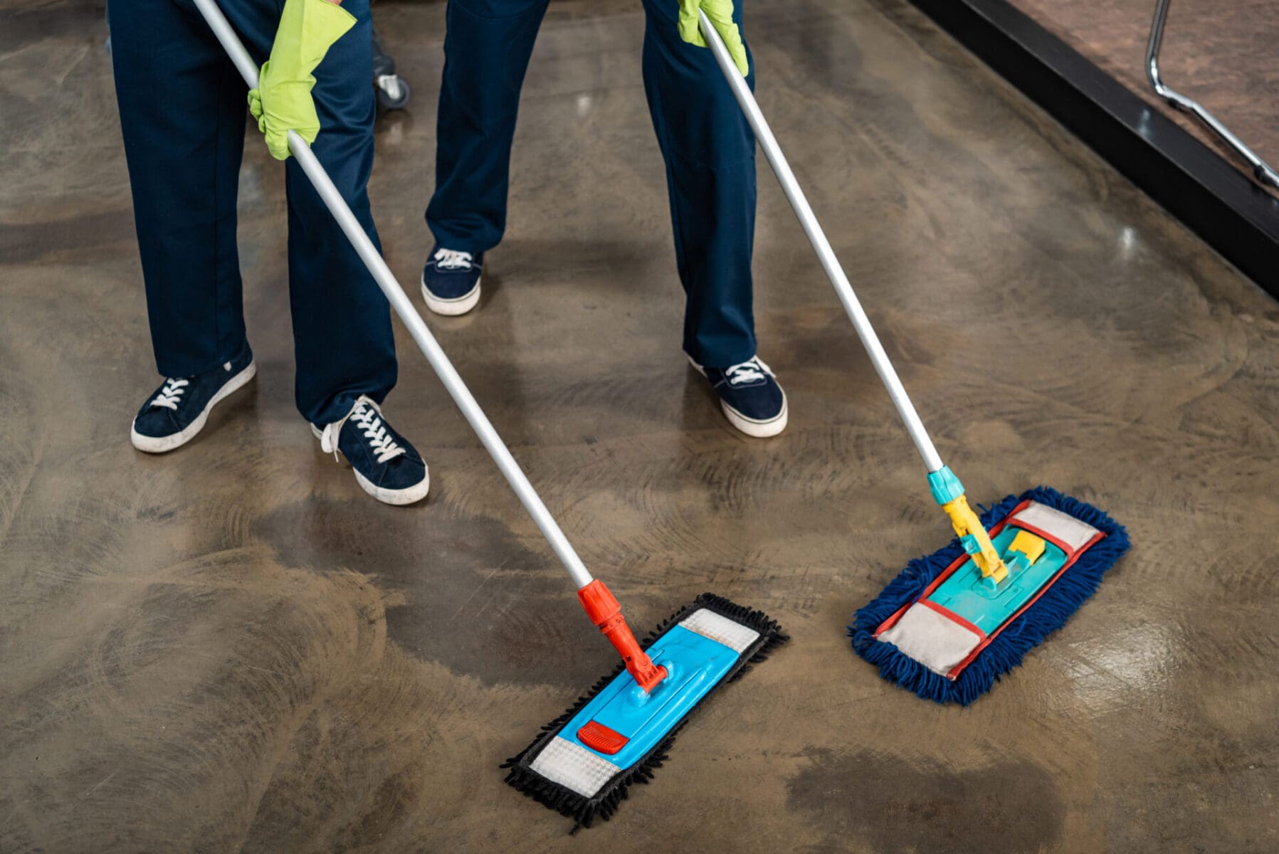 cropped view of two cleaners washing floor with mops floor waxing Oceanside