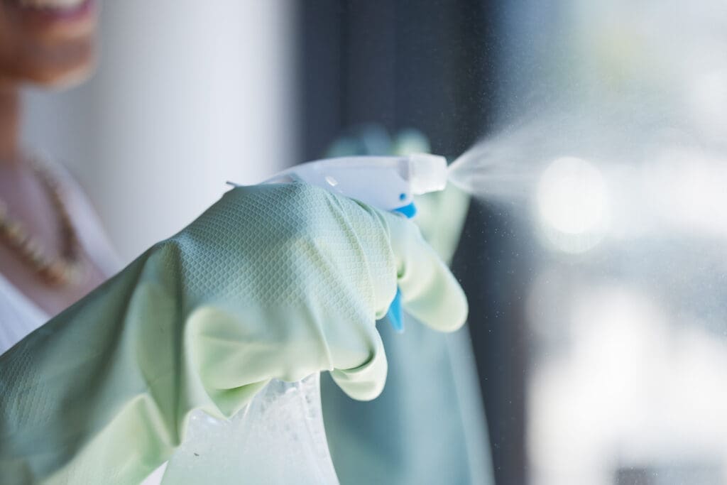 someone disinfecting a surface