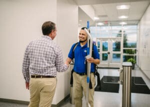 Commercial-Cleaning-Successful-Business JAN-PRO Alabama cleaner shaking hands with a client