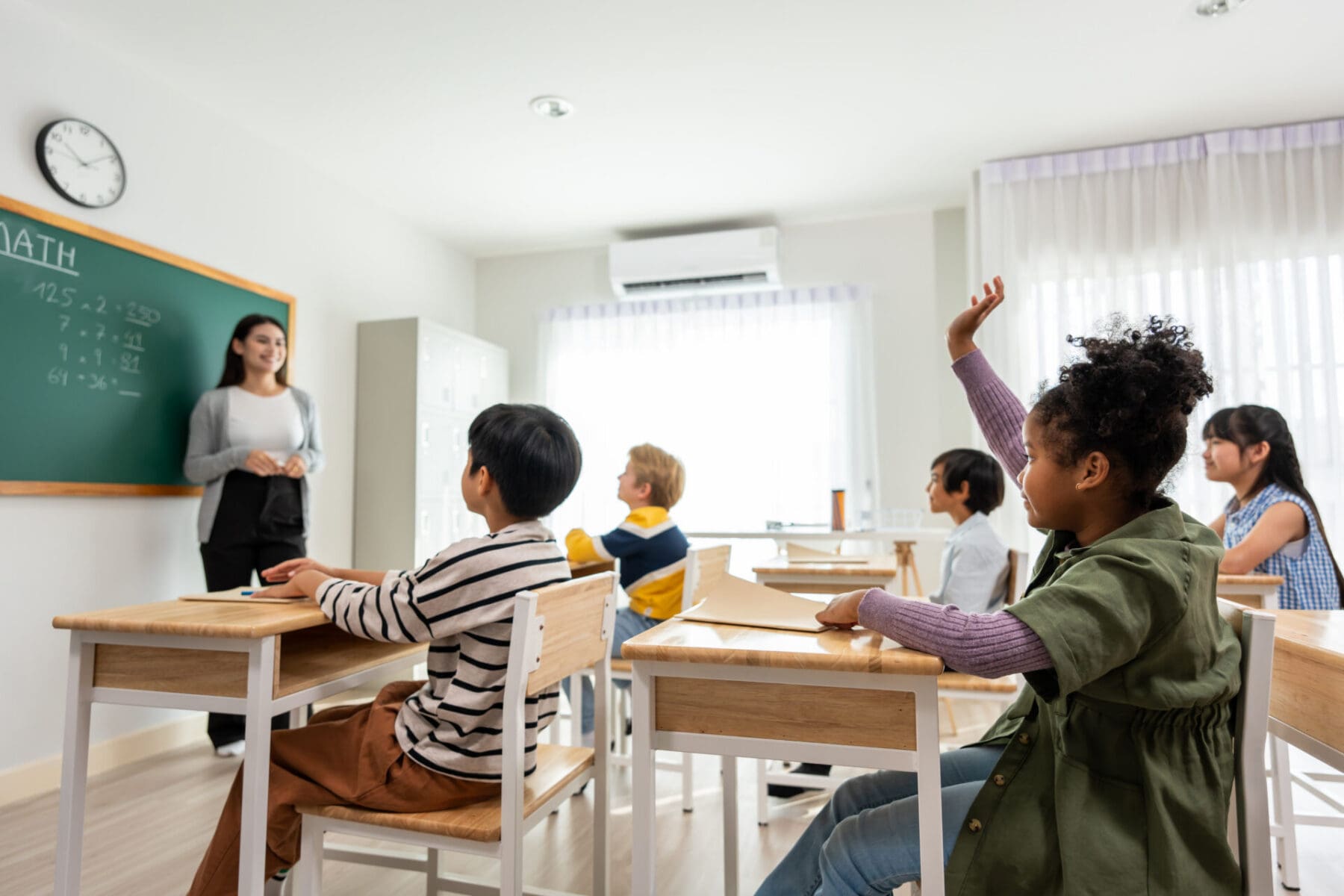 children participating in the classroom