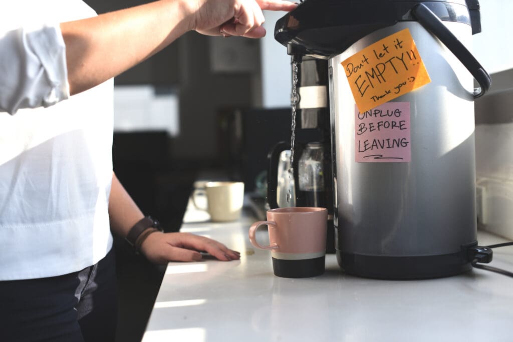 Coffee brewer drip trays and water cooler dispense nozzles
