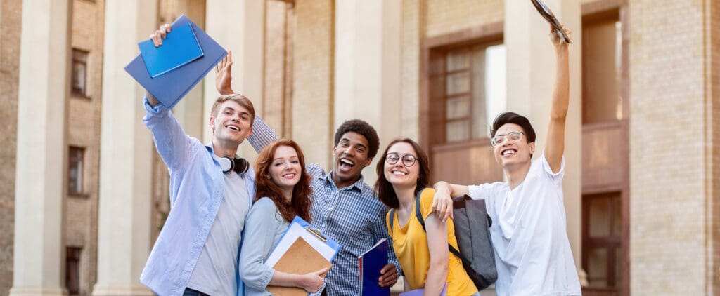 young students celebrating scholarship